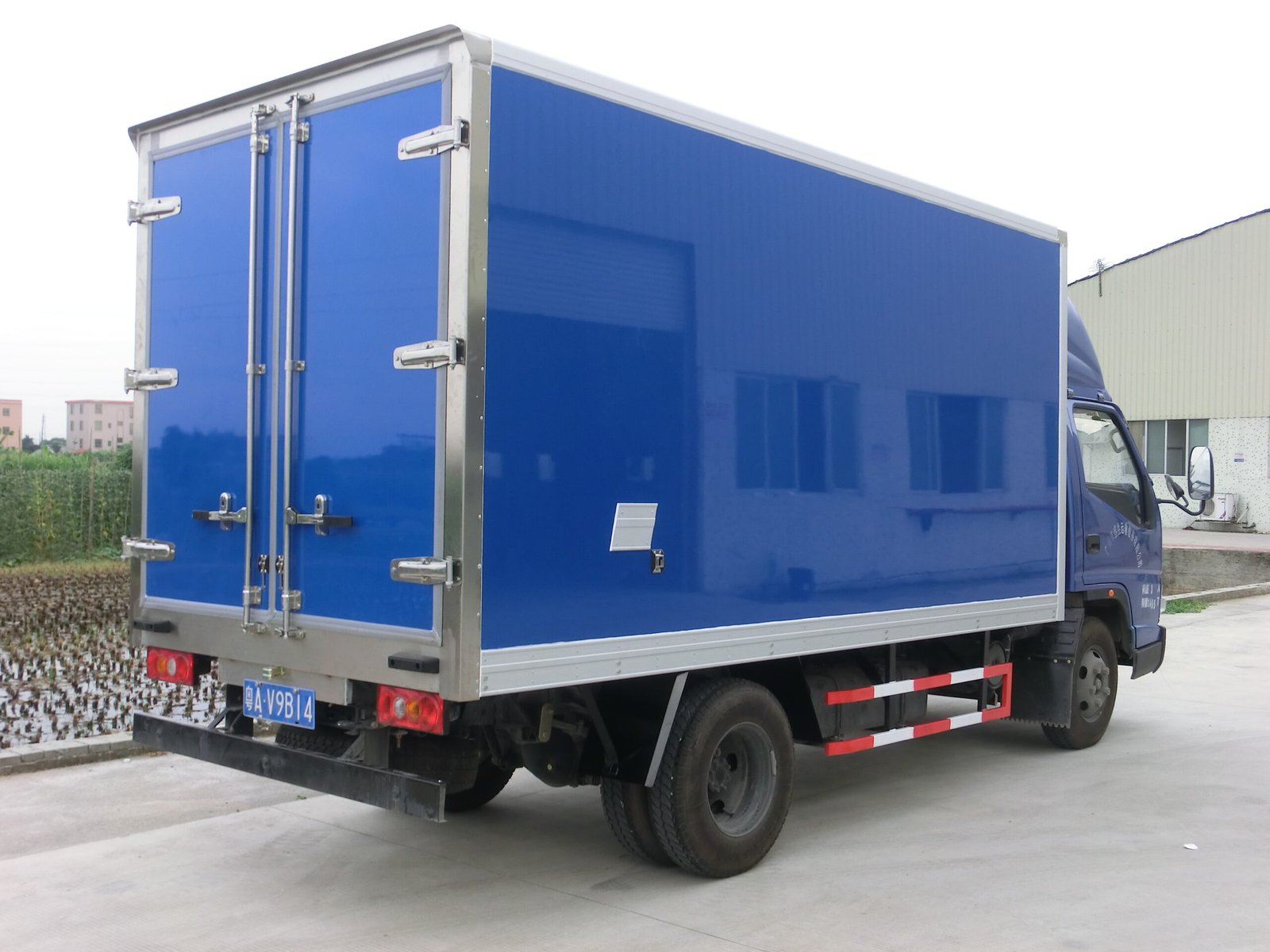 Blue refrigerated truck body with rear double doors