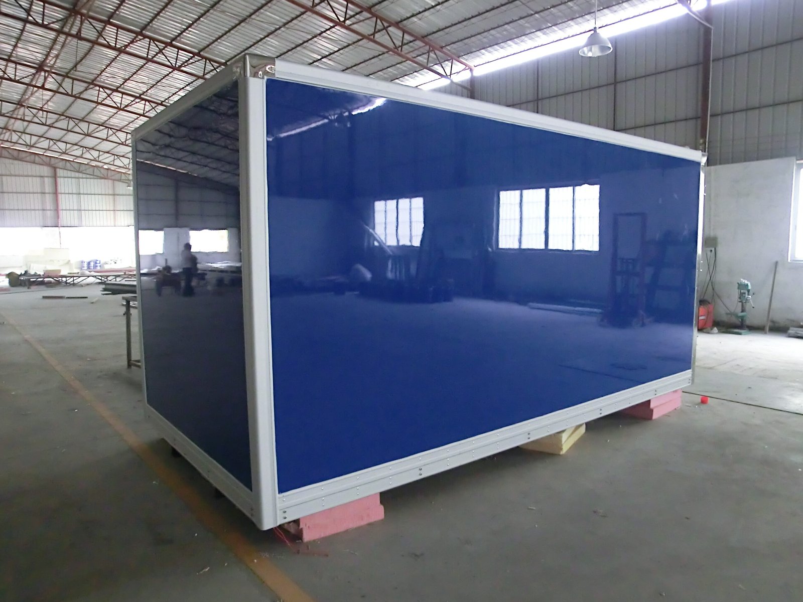 Blue refrigerated truck body shell in the factory
