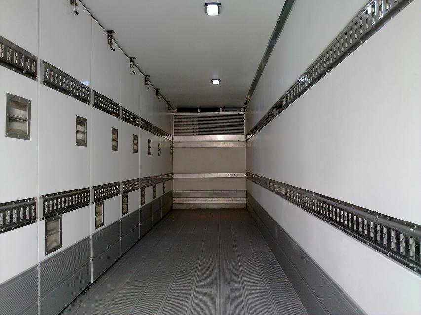 White body interior with horizontal cargo tracks along the walls