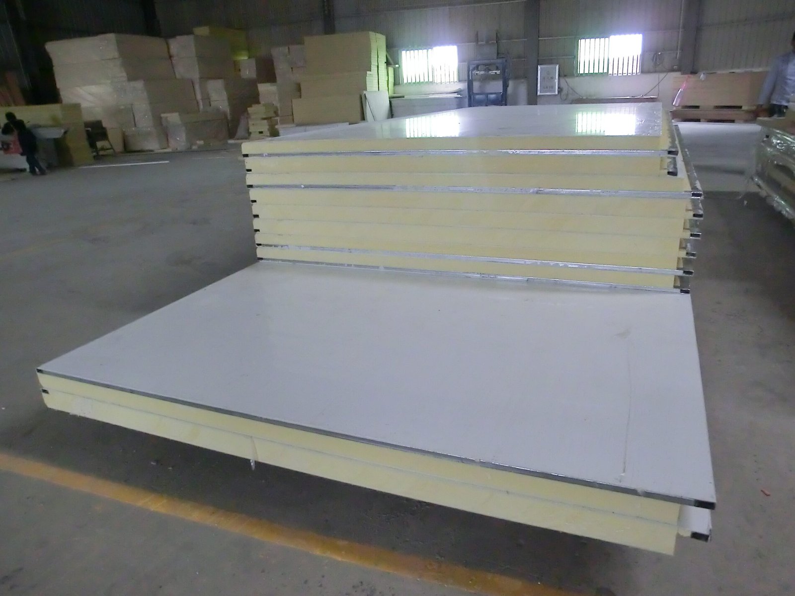Stacked insulated panels with a separate panel in the foreground.